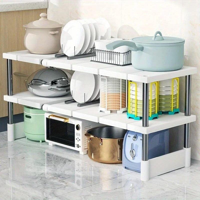 Stainless Steel Kitchen Storage Rack β a durable, rust-resistant stainless steel kitchen storage rack shelf designed for countertops or under-sink organization. Features an expandable, adjustable design with non-slip rubber feet for stability, perfect for maximizing kitchen storage space.